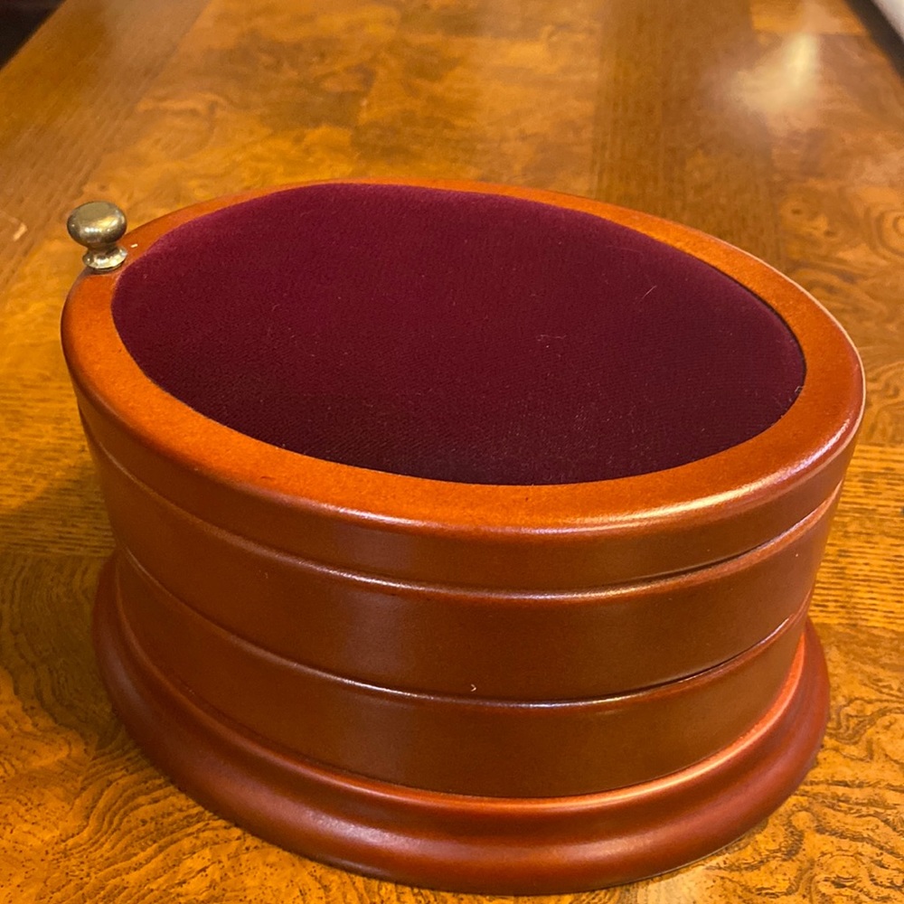 2 layer wooden coin/jewelry box, suede top as well as lining.